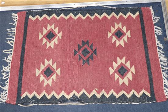 A Bokhara peach ground rug and three Turkish geometric rugs, largest 200 x 100cm.